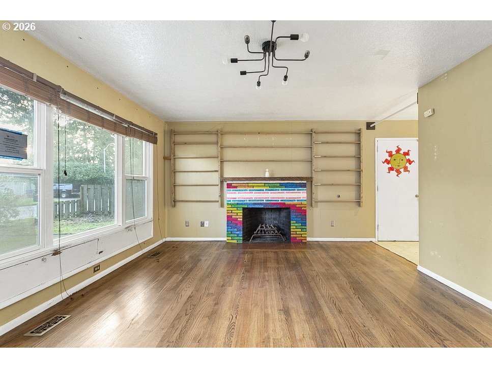 14035 Southeast Harrison Street Portland, OR 97233 - Photo 4 of 32 a view of an empty room with a window