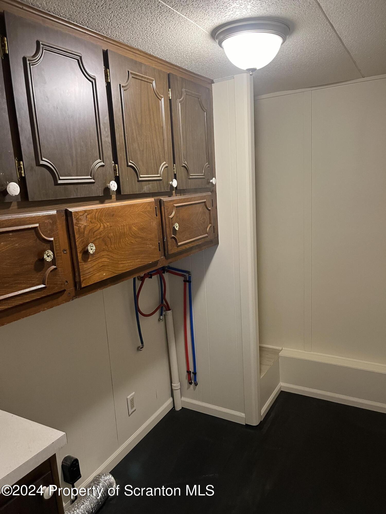 64 Franklin Street Great Bend, PA 18821 - Photo 20 of 33 a bathroom with a sink a toilet and mirror