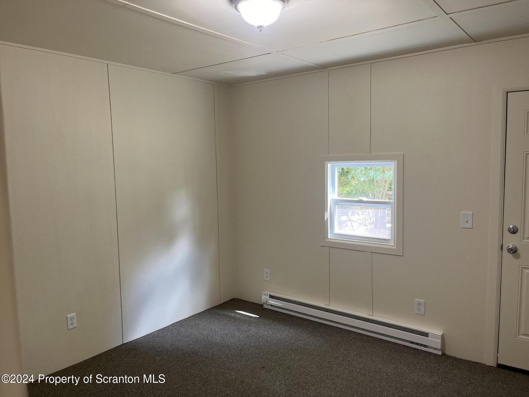 64 Franklin Street Great Bend, PA 18821 - Photo 27 of 33 an empty room with windows