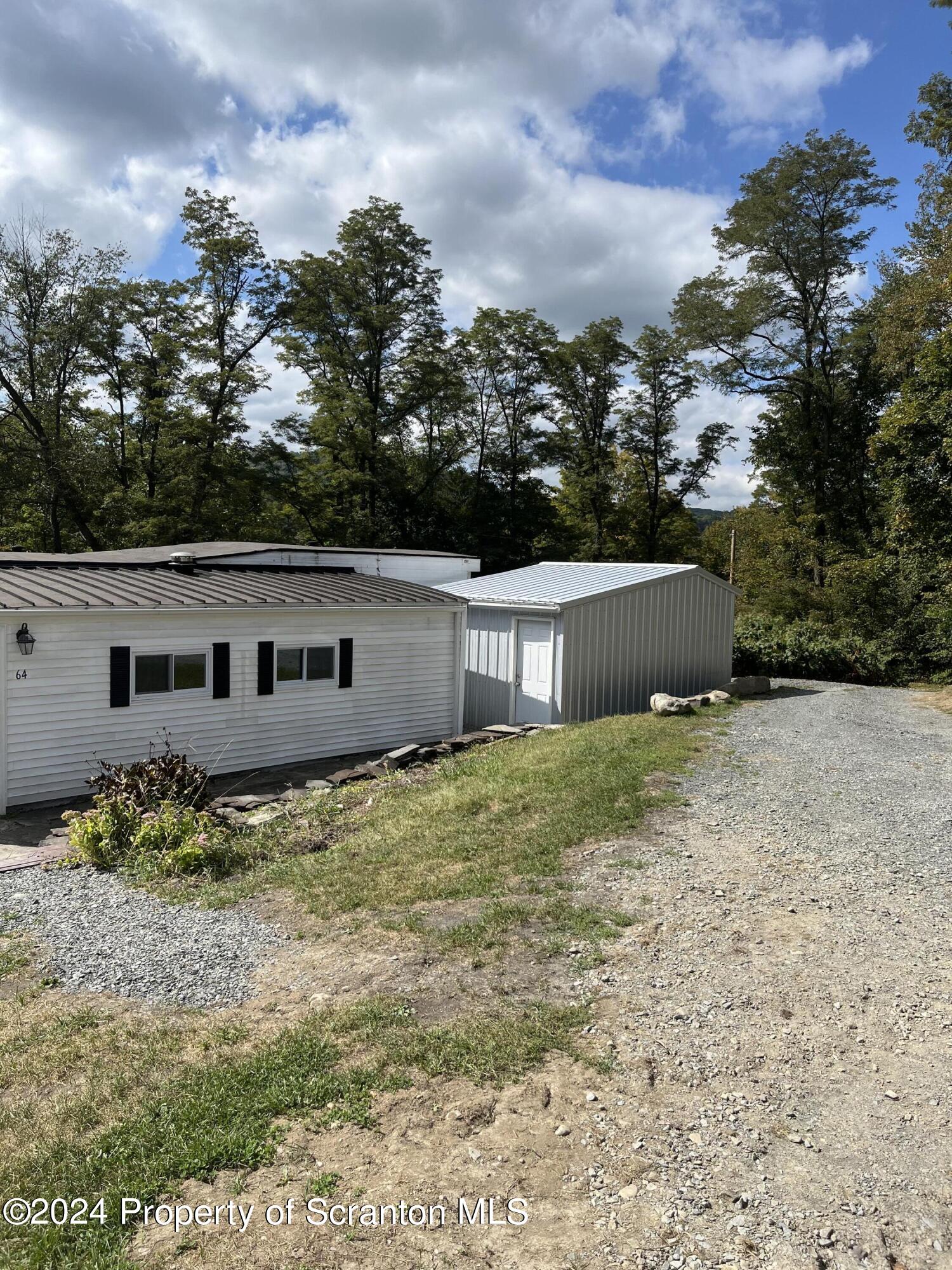 64 Franklin Street Great Bend, PA 18821 - Photo 3 of 33 a backyard of a house with lots of green space