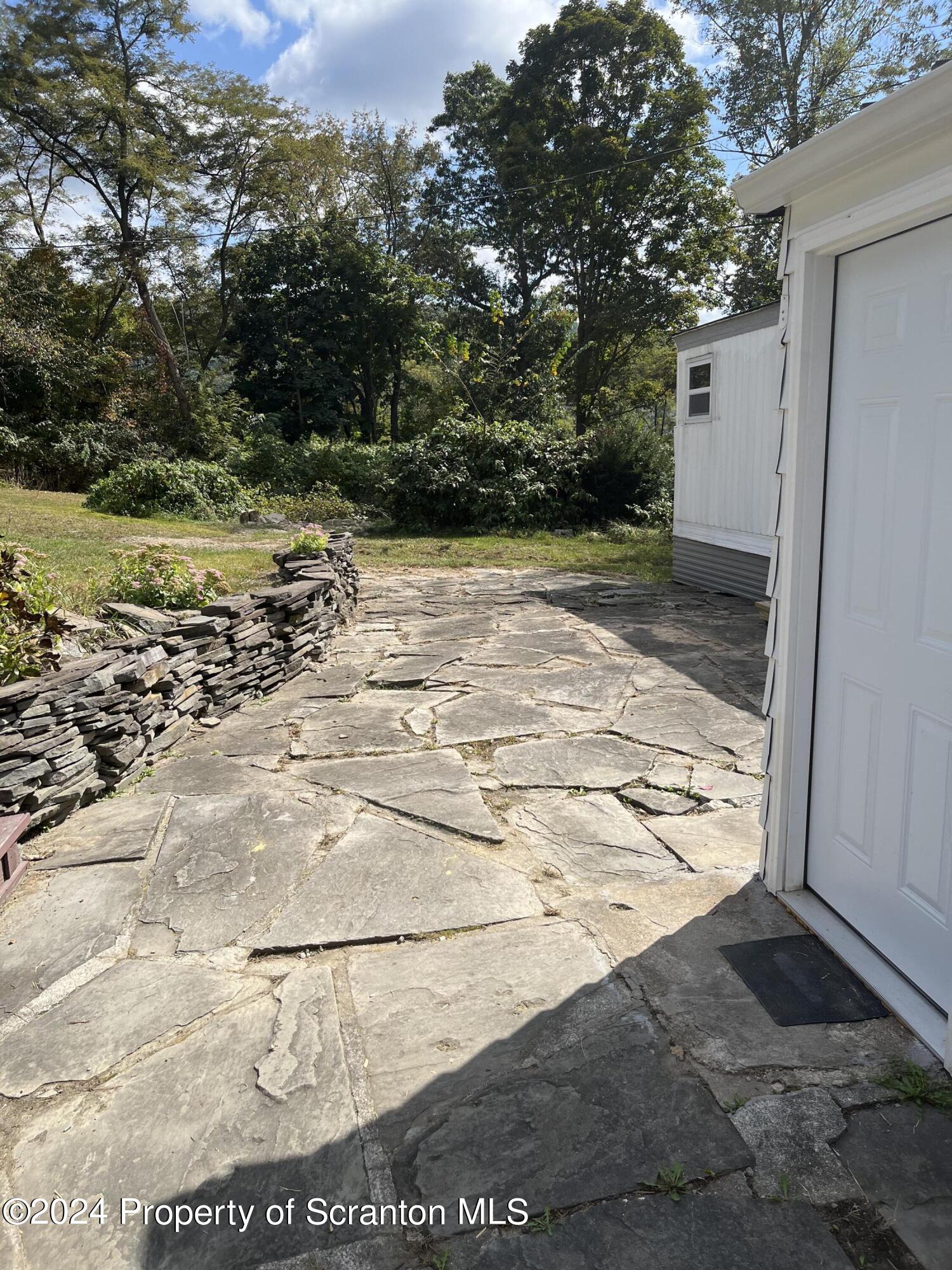 64 Franklin Street Great Bend, PA 18821 - Photo 4 of 33 a view of a yard with an outdoor space