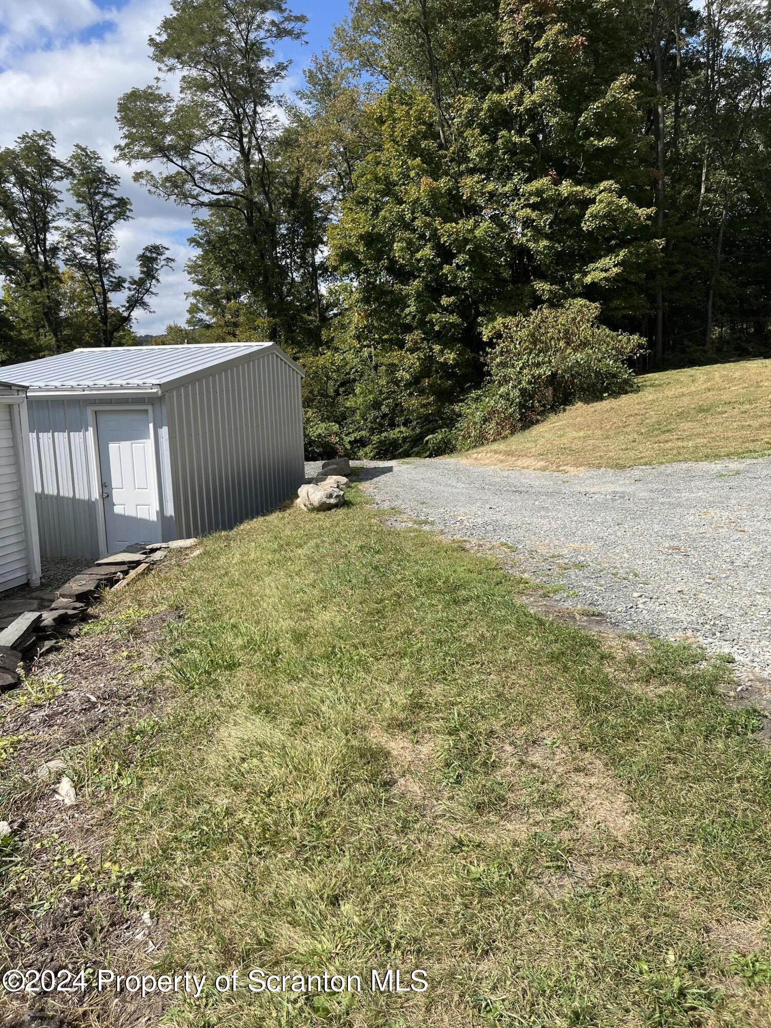 64 Franklin Street Great Bend, PA 18821 - Photo 5 of 33 a view of empty yard with large trees