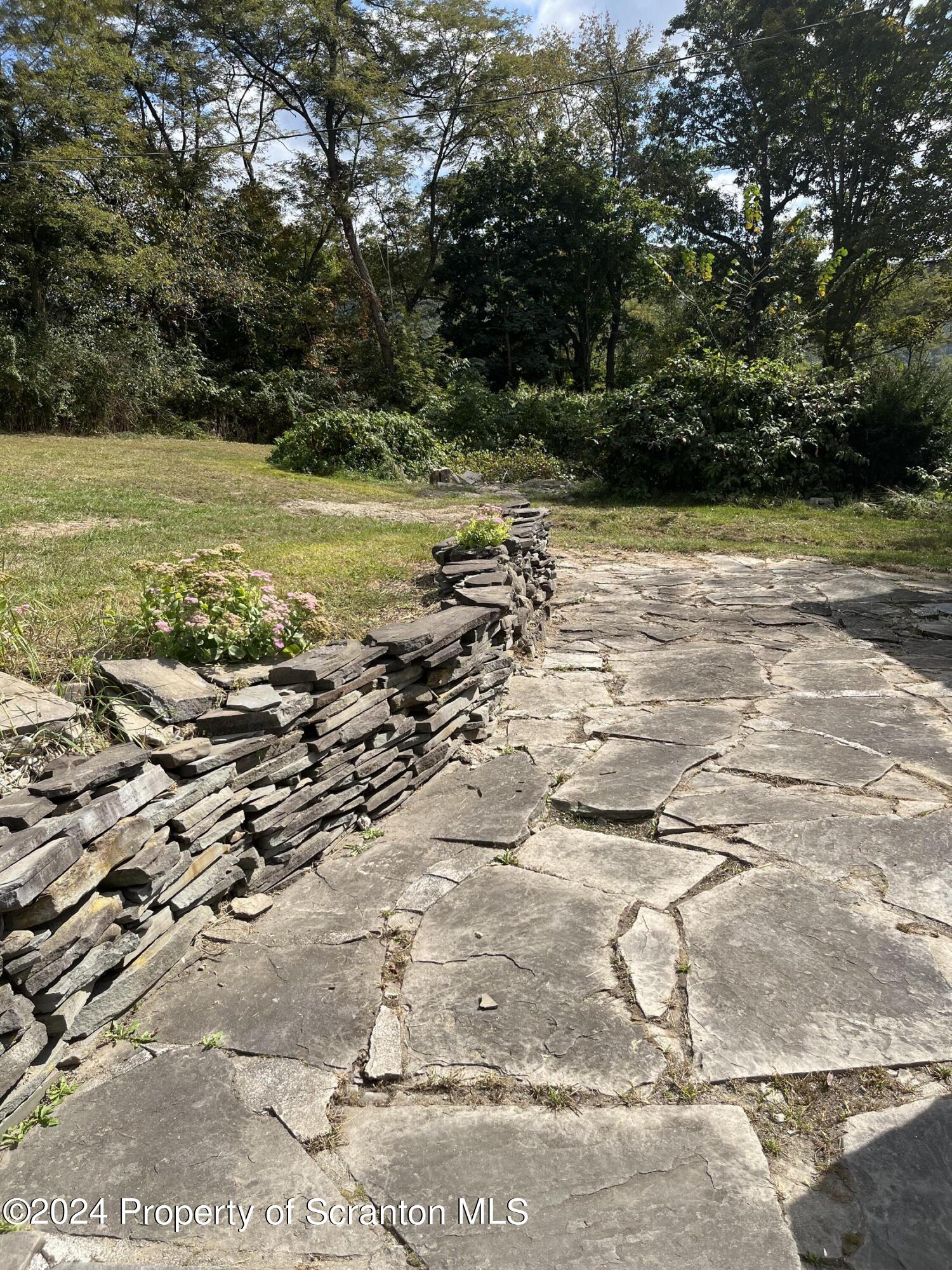 64 Franklin Street Great Bend, PA 18821 - Photo 6 of 33 a view of a lake with a yard