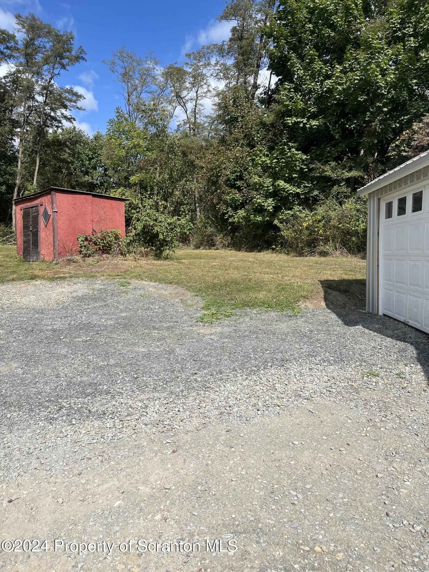 64 Franklin Street Great Bend, PA 18821 - Photo 9 of 33 a view of a yard with an tree