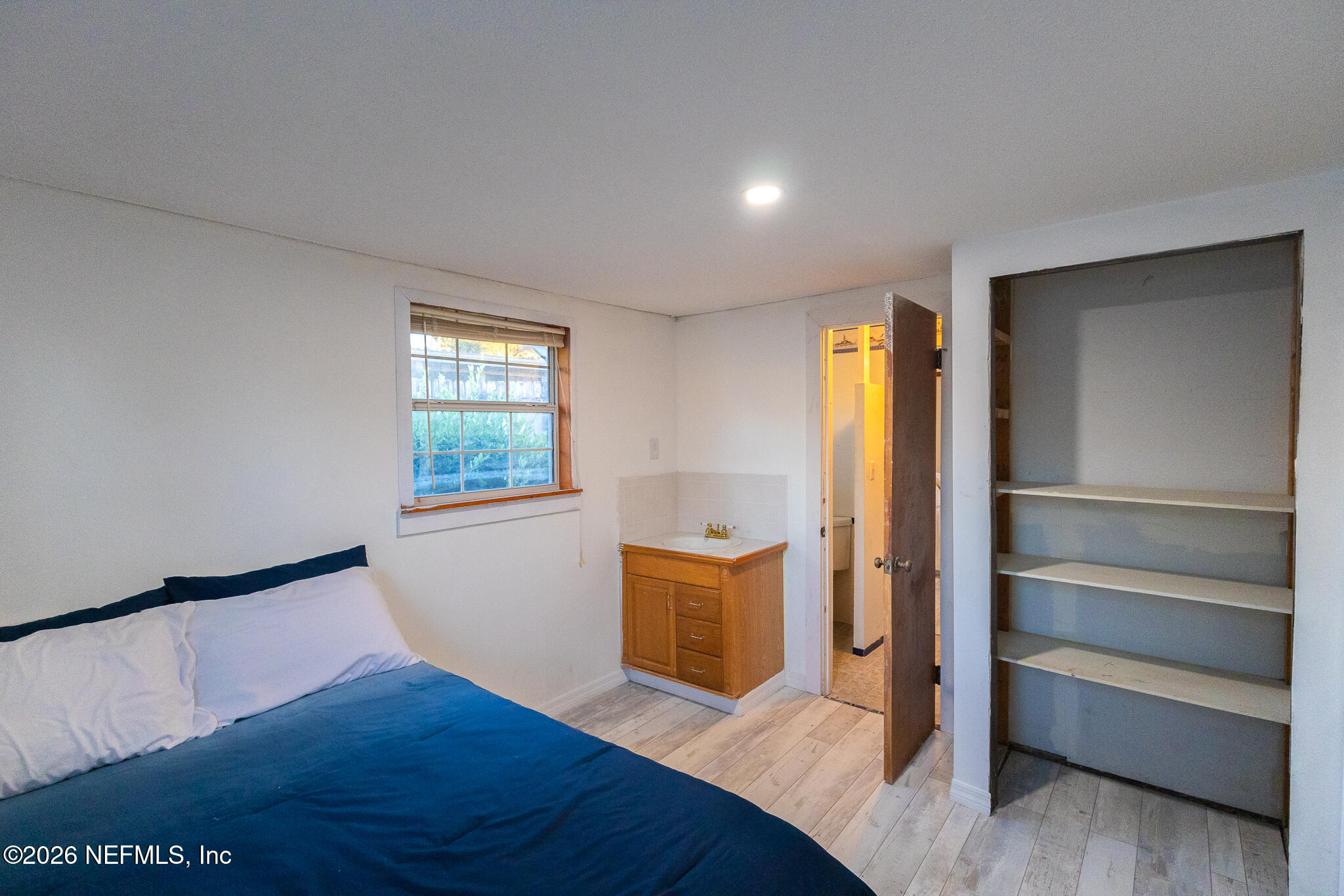 110 Jimmie Road Crescent City, FL 32112 - Photo 12 of 54 a view of empty room with wooden floor and fan