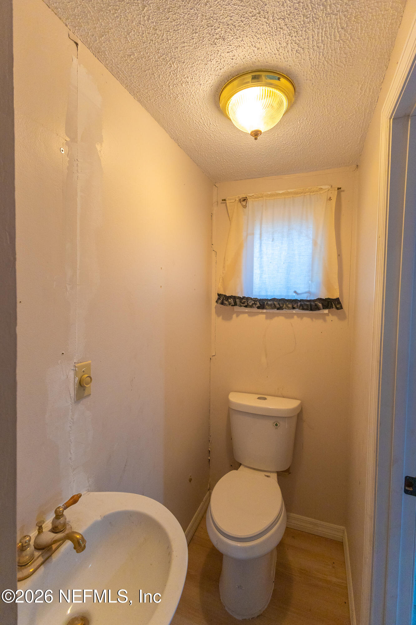 110 Jimmie Road Crescent City, FL 32112 - Photo 13 of 54 a bathroom with a toilet and a sink