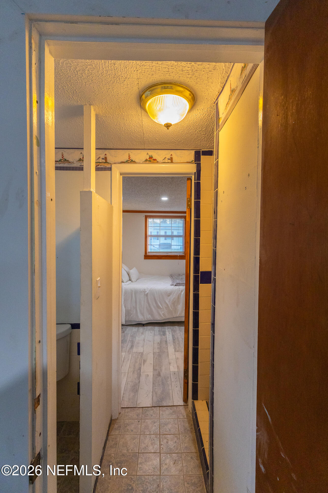 110 Jimmie Road Crescent City, FL 32112 - Photo 19 of 54 a bathroom with a glass shower door and a mirror