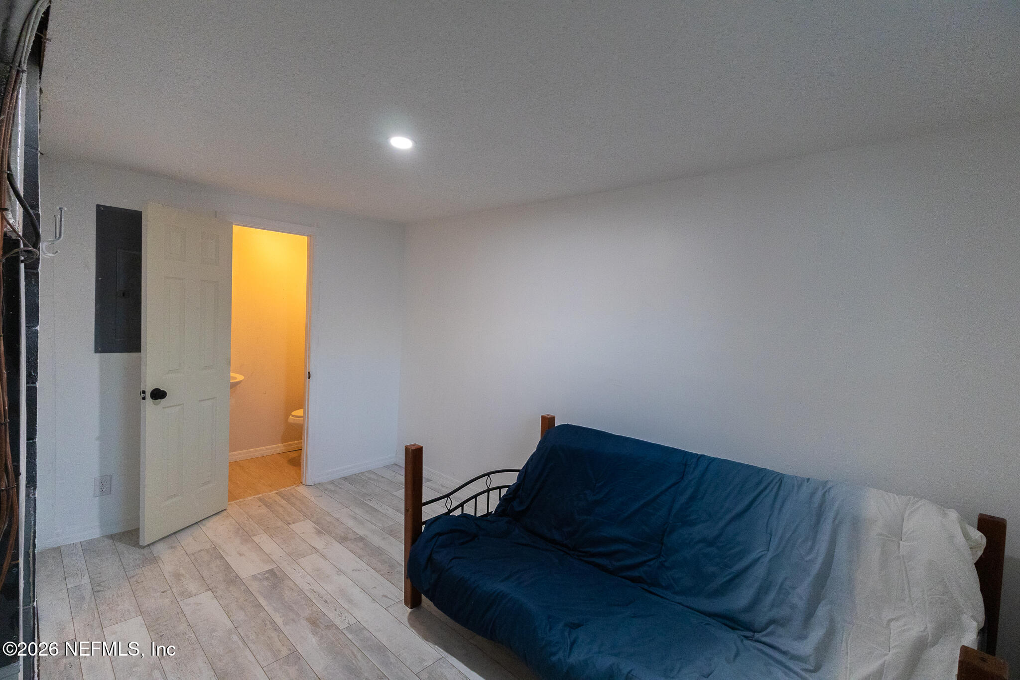 110 Jimmie Road Crescent City, FL 32112 - Photo 20 of 54 a living room with a couch and a dresser with wooden floor