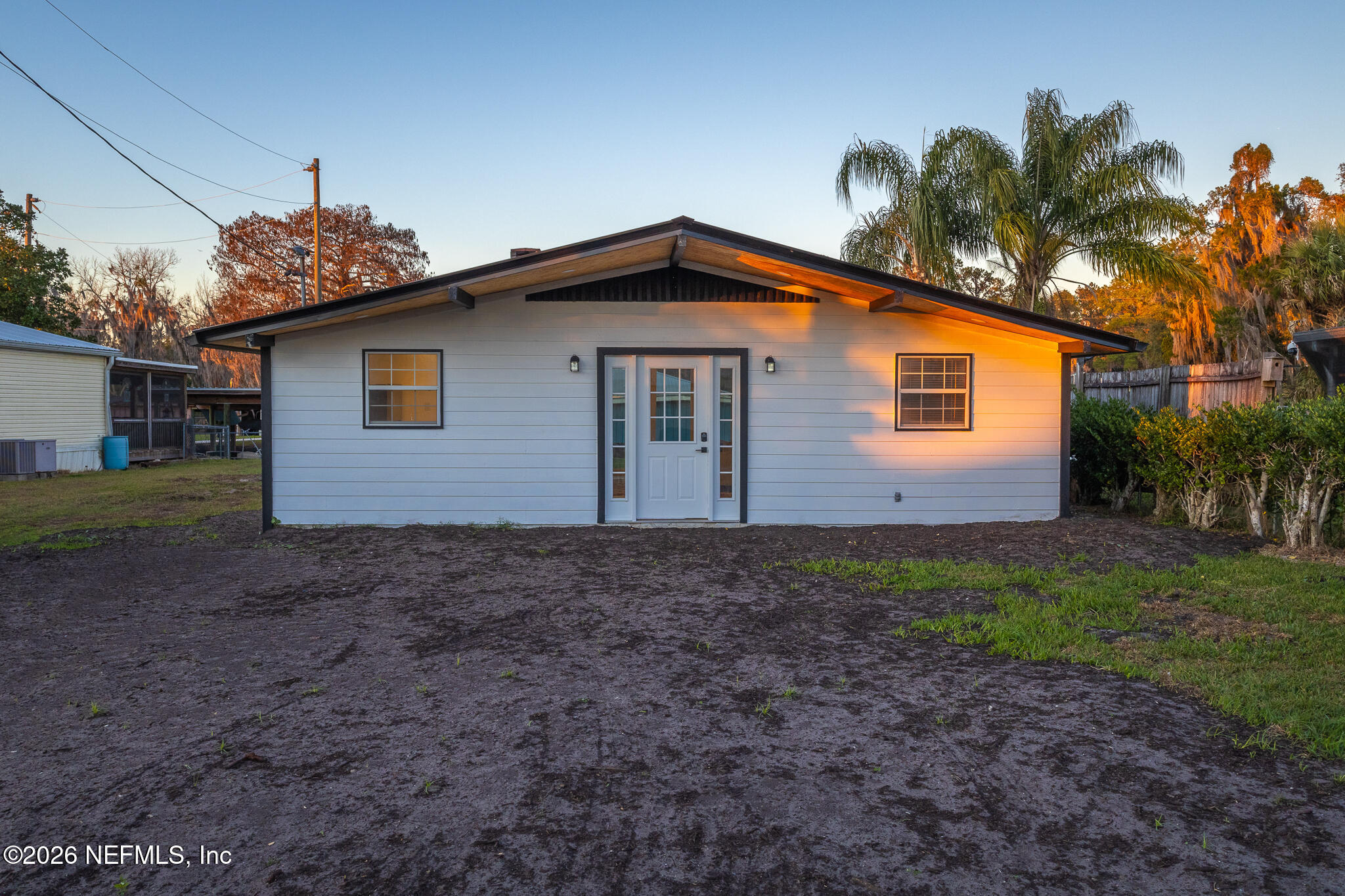 110 Jimmie Road Crescent City, FL 32112 - Photo 2 of 54 a front view of a house with a yard and garage