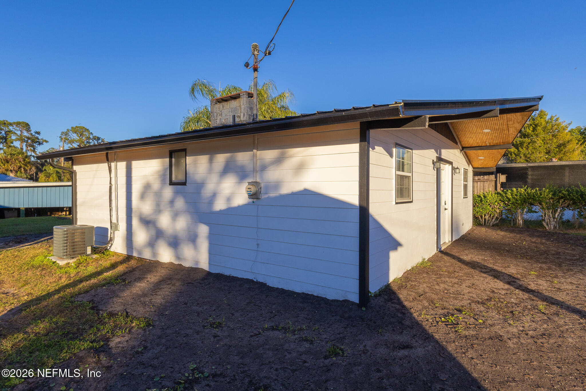 110 Jimmie Road Crescent City, FL 32112 - Photo 33 of 54 a view of a porch with a table and chairs under an umbrella