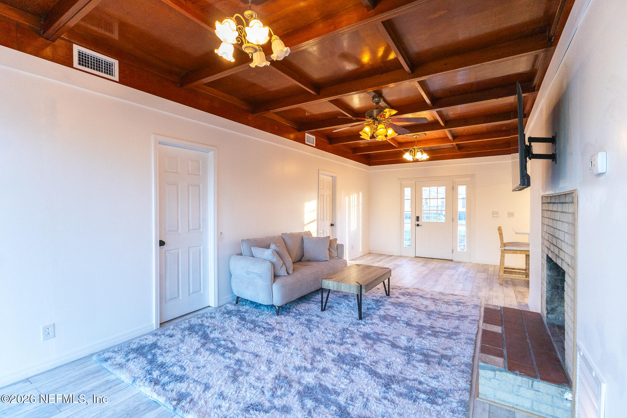 110 Jimmie Road Crescent City, FL 32112 - Photo 7 of 54 a living room with furniture and a fireplace