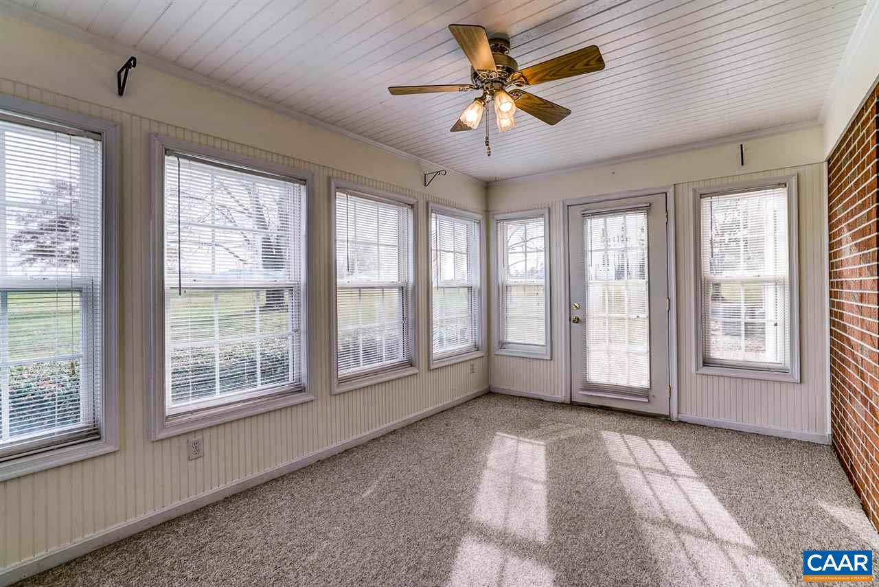43 March Road Stanardsville, VA 22973 - Photo 14 of 26 a view of an empty room with a window and a kitchen