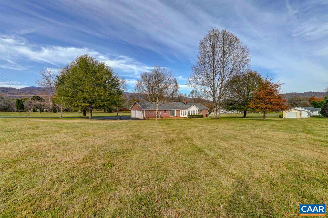 43 March Road Stanardsville, VA 22973 - Photo 5 of 26 a view of swimming pool with outdoor seating and covered with trees