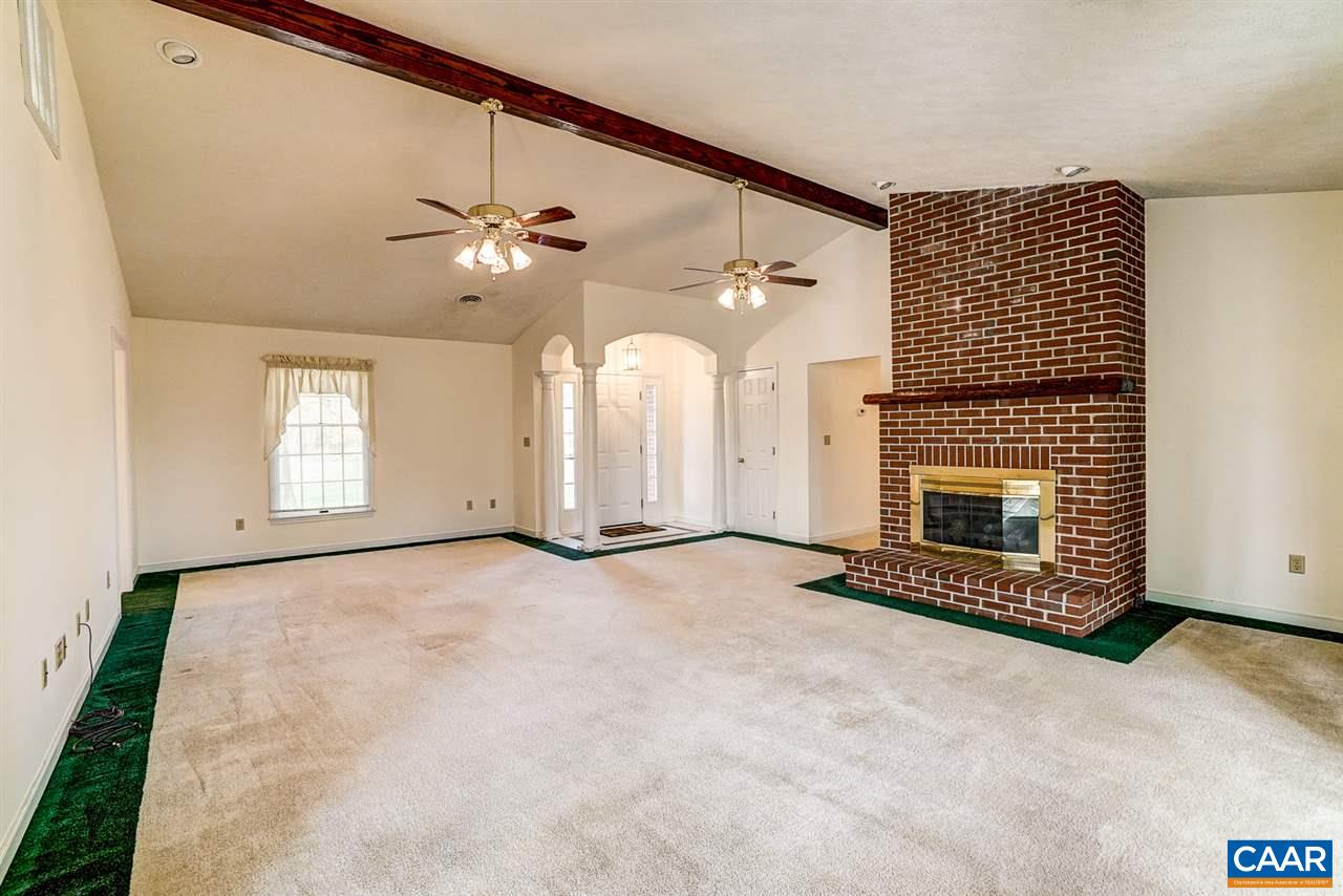 43 March Road Stanardsville, VA 22973 - Photo 8 of 26 an empty room with windows and fireplace