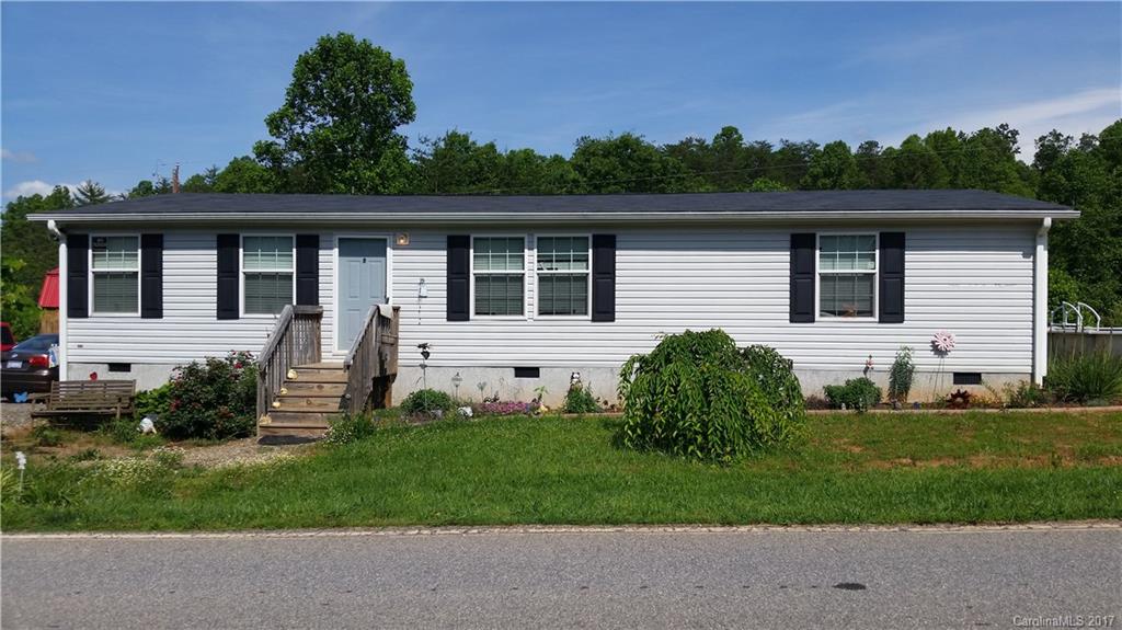 250 Gouges Branch Road Leicester, NC 28748 - Photo 1 of 2 a front view of a house with a yard
