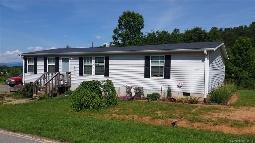 250 Gouges Branch Road Leicester, NC 28748 - Photo 2 of 2 a front view of a house with a yard