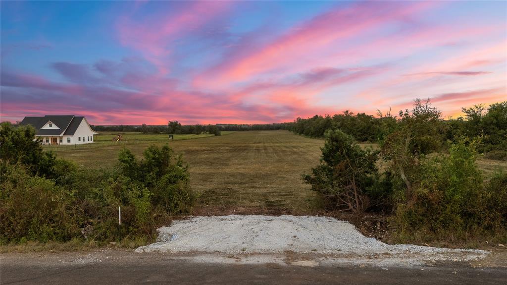 8153 Prairie Chapel Road Crawford, TX 76638 - Photo 17 of 32 a view of a lake with a big yard