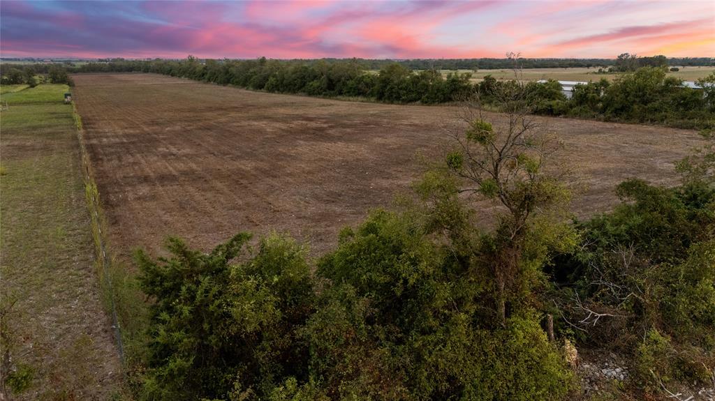 8153 Prairie Chapel Road Crawford, TX 76638 - Photo 18 of 32 a view of a lake with a mountain in the background
