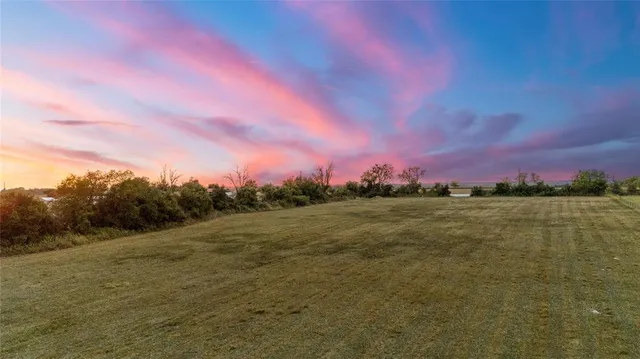a view of a lake in front of a house with a lake
