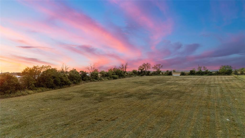 8153 Prairie Chapel Road Crawford, TX 76638 - Photo 20 of 32 a view of a lake from a yard