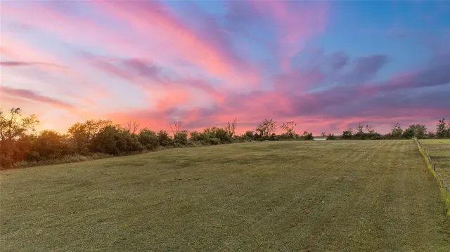 a view of a city with lush green forest
