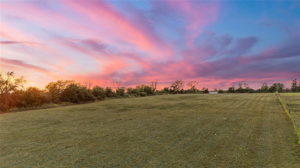 8153 Prairie Chapel Road Crawford, TX 76638 - Photo 22 of 32 a view of a lake in front of a house with a lake