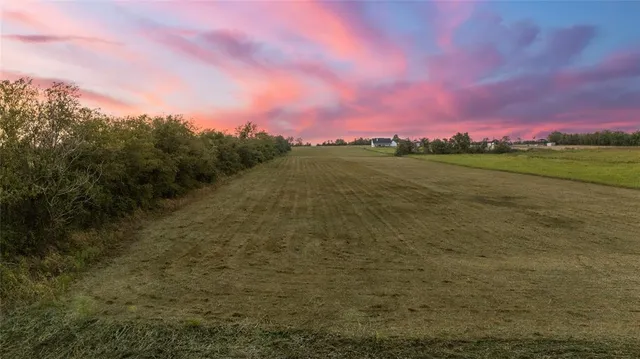 a view of a lake and a yard