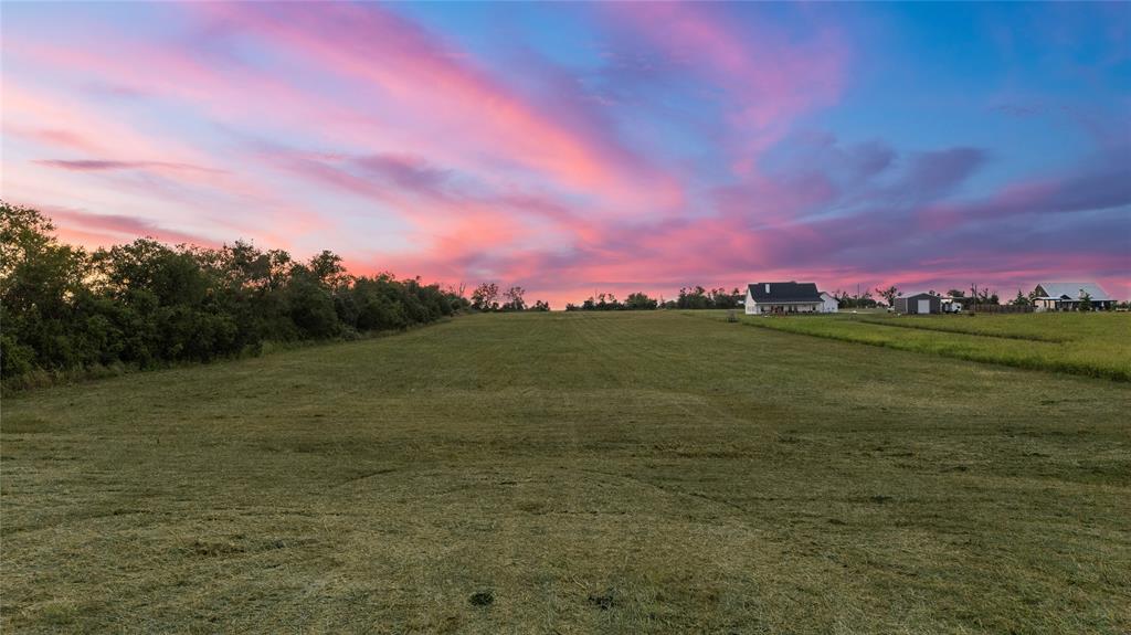 8153 Prairie Chapel Road Crawford, TX 76638 - Photo 28 of 32 a view of a lake and a yard