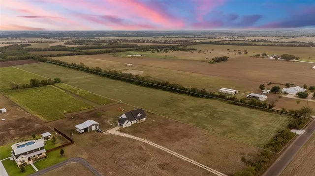 a view of a lake with beach and city