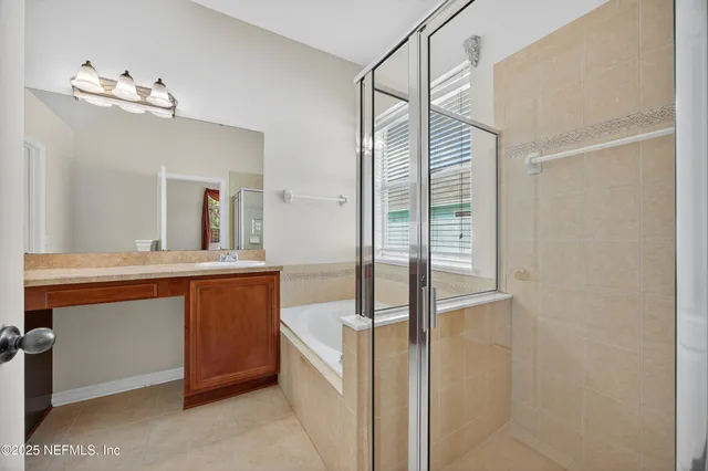 a bathroom with a sink a mirror and a shower