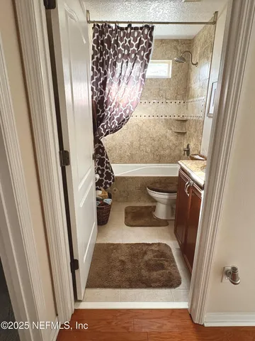 a bathroom with a bathtub and shower