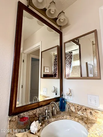 a bathroom with a bathtub and a mirror