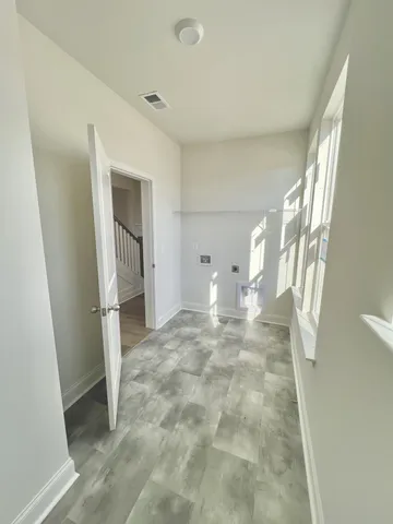 a view of entryway with wooden floor