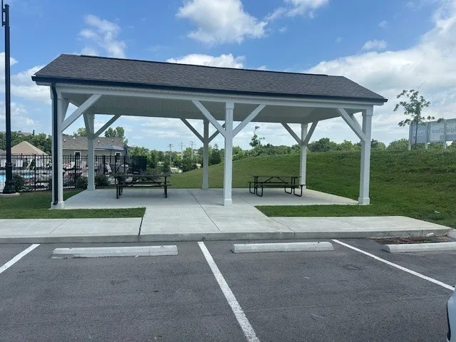 a view of yard with porch and patio