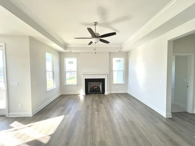 a view of a room window and wooden floor