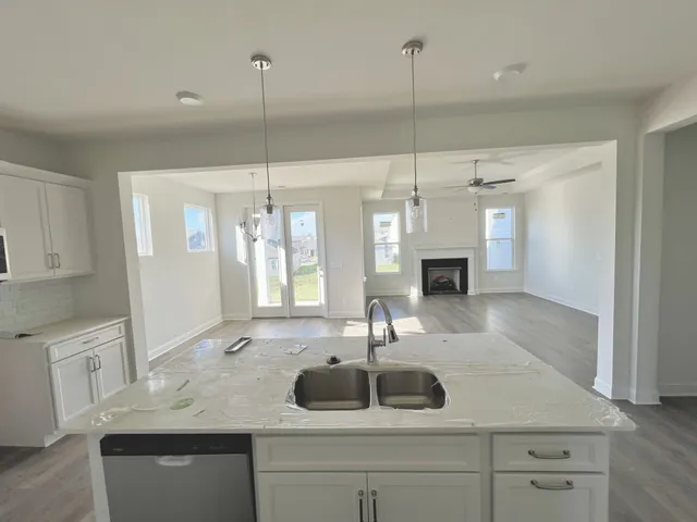 a kitchen with a sink and a refrigerator
