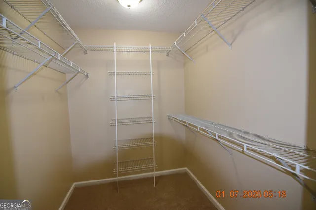 a view of a room with racks on the wall