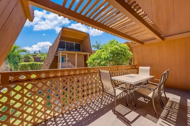 a view of balcony with wooden floor