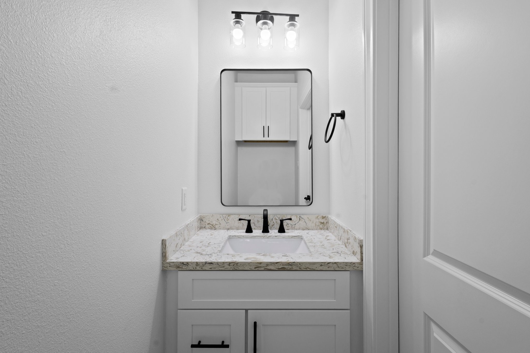 5250 HIghlander Drive Orange, TX 77630 - Photo 15 of 20 a bathroom with a granite countertop sink and a mirror