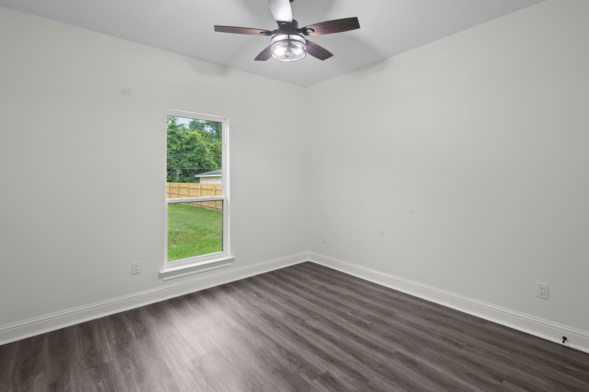 5250 HIghlander Drive Orange, TX 77630 - Photo 18 of 20 an empty room with a window and a fan