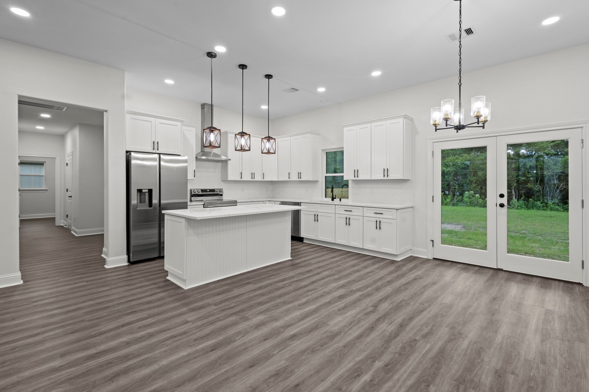 5250 HIghlander Drive Orange, TX 77630 - Photo 4 of 20 a large kitchen with granite countertop a large counter top a sink stainless steel appliances and cabinets