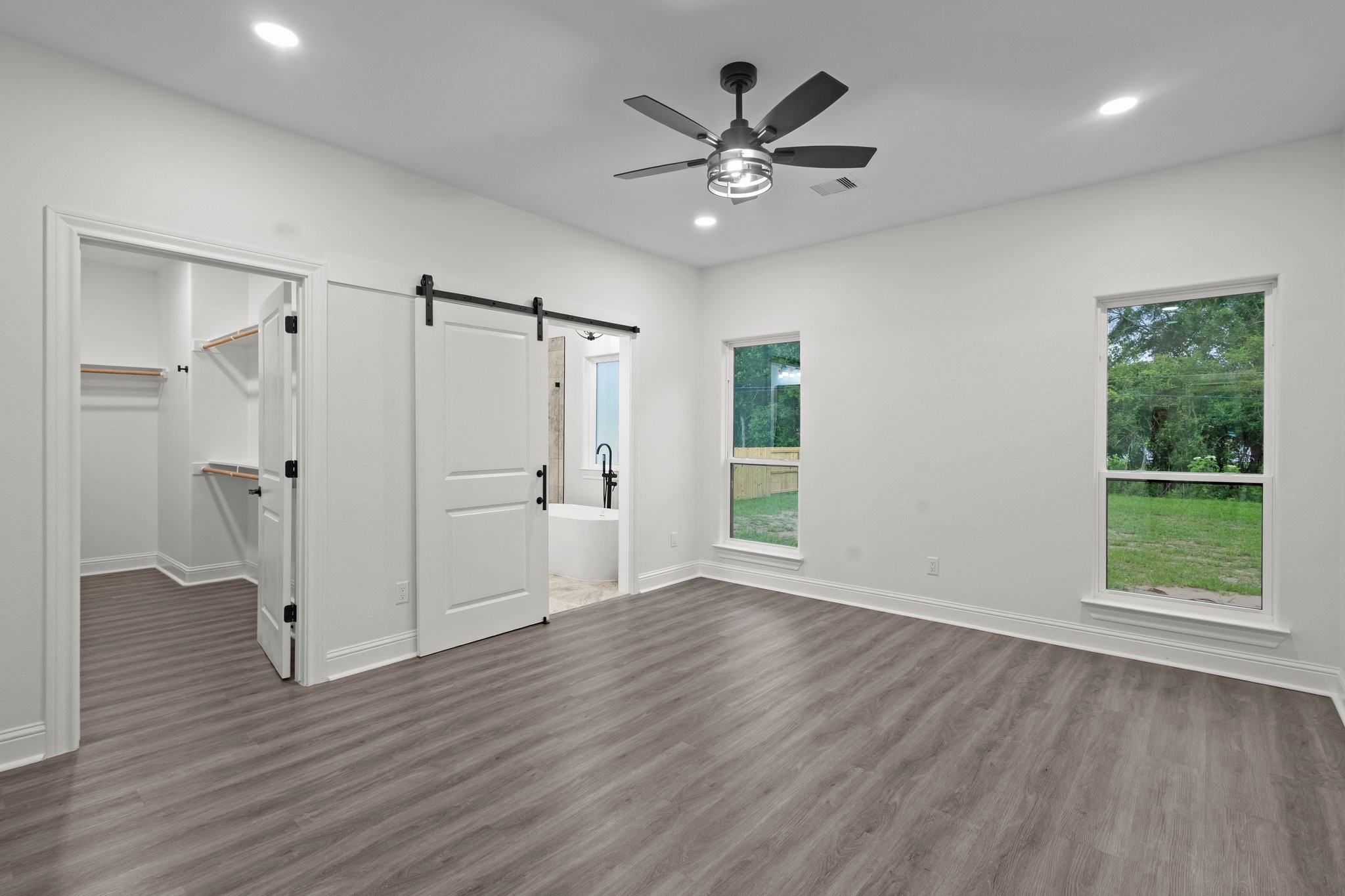 5250 HIghlander Drive Orange, TX 77630 - Photo 9 of 20 a view of an empty room with wooden floor and a window