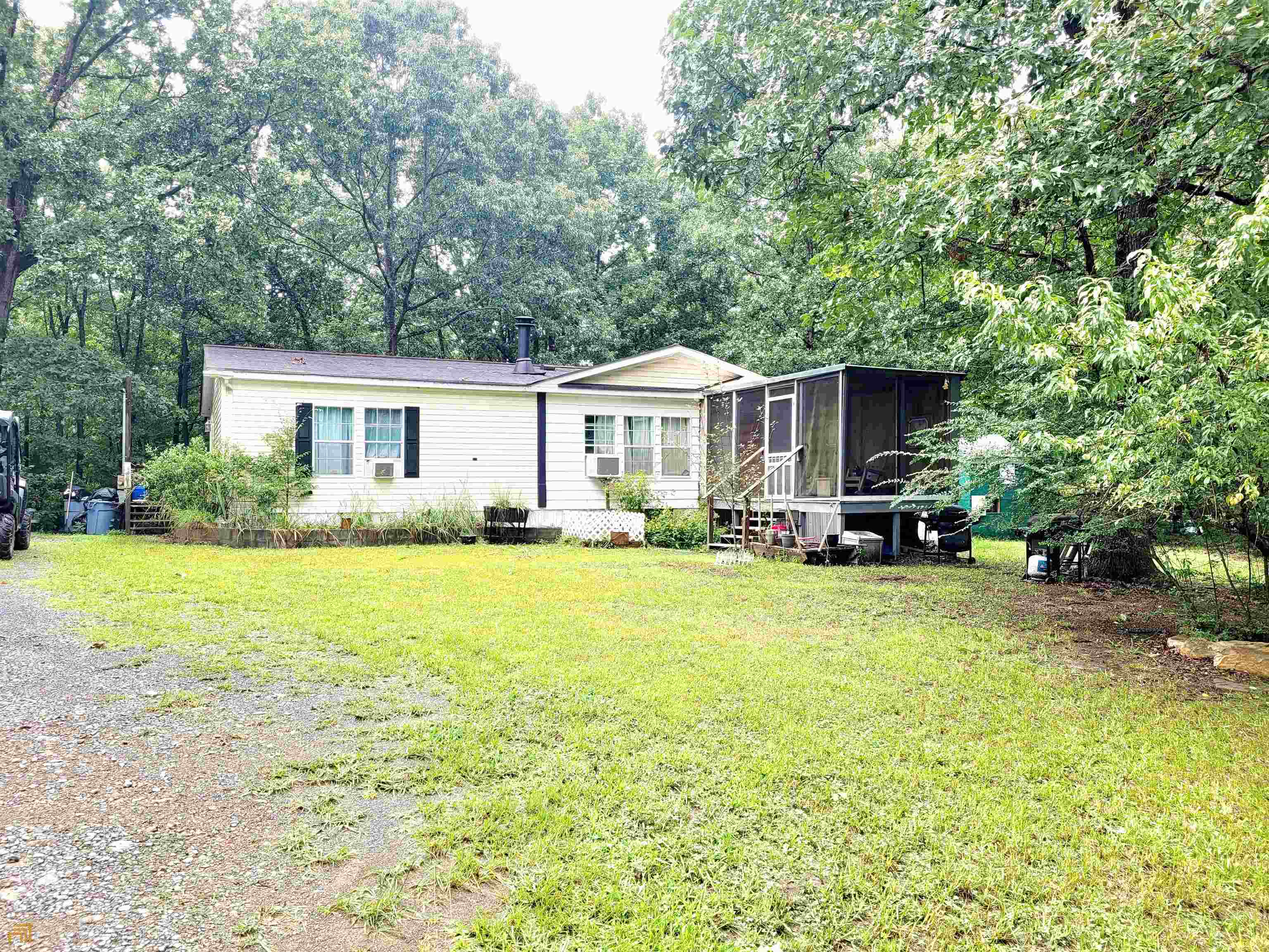 156 Chubb Road Lindale, GA 30147 - Photo 1 of 1 a front view of a house with garden