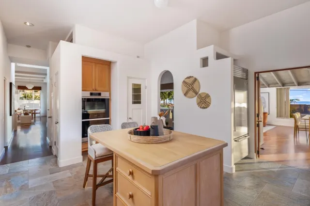 a kitchen with a table and chairs