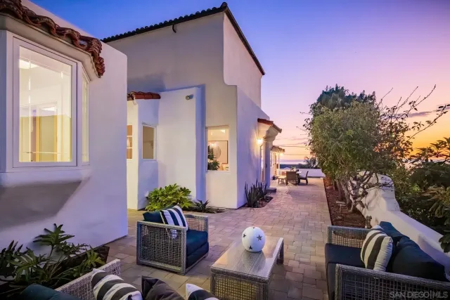 a view of a porch with furniture and a potted plant
