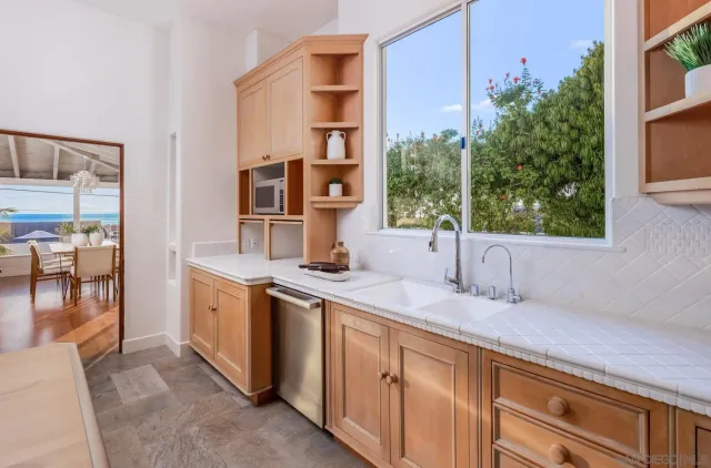 a bathroom with a sink and a window