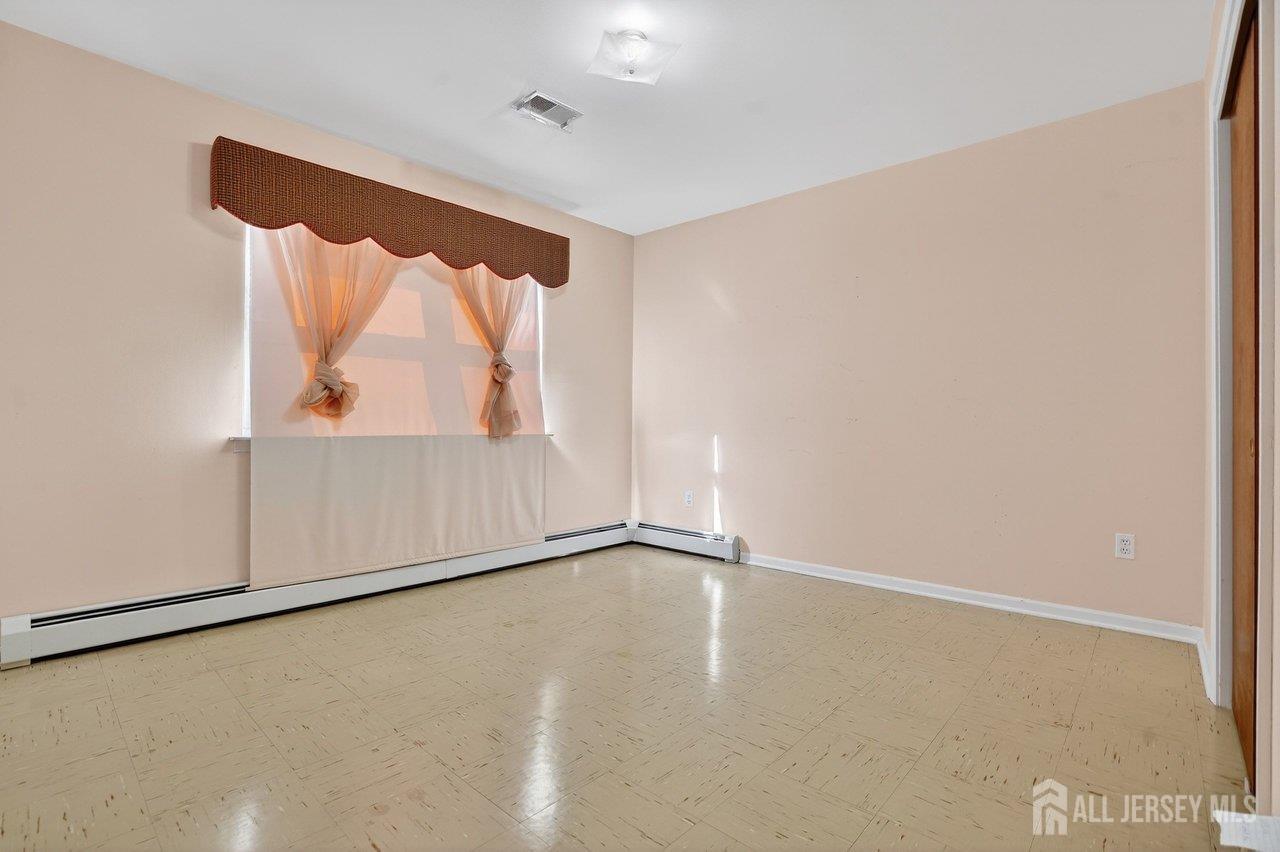 1 Wakefield Drive Edison, NJ 08820 - Photo 20 of 29 an empty room with a window