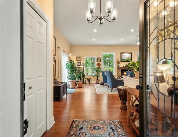 a view of a livingroom with furniture and a floor to ceiling window
