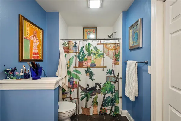 a bathroom with a sink toilet and mirror