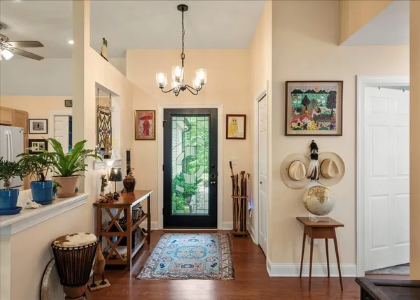 a view of a room with furniture and wooden floor